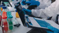Researchers in laboratory working on drug development
