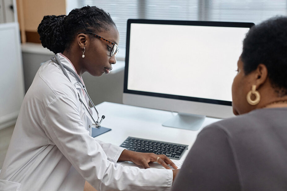 Female doctor with a female patient, suggestive of women's health