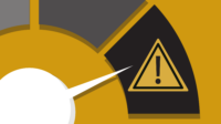 Yellow background showing a white dial with increasingly dark sections. The dial is close to the highest setting showing a warning sign