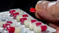 A close-up image of a blister pack of ramipril capsules
