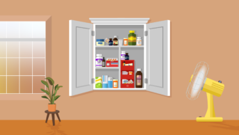 A window with whites yellows and oranges behind, shines into a room with terracotta walls. In the middle a medicine cabinet full of pharmaceuticals. On the right a fan and a wilting plant