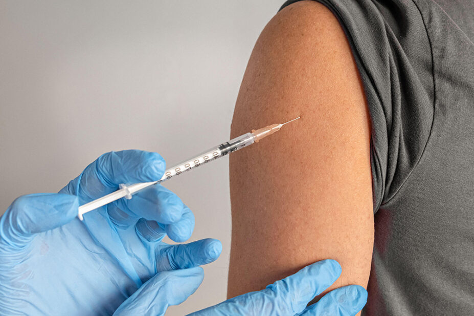 A young person receives a vaccination