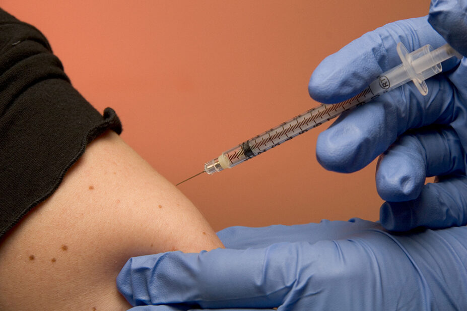 A patient receives a vaccination