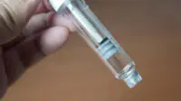 A person holds a weight-loss injection pen
