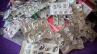 A pile of empty blister packs of medicines