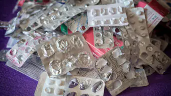 A pile of empty blister packs of medicines
