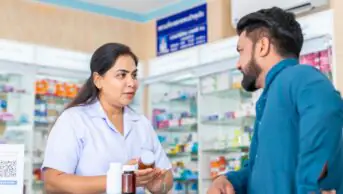 Consultation between a pharmacist and member of the public in a pharmacy