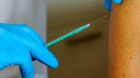 A patient receives a vaccination