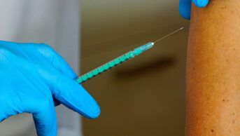 A patient receives a vaccination