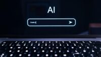 AI prompt in chat screen on a laptop, keyboard visible below.