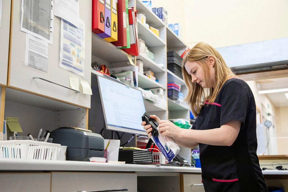 A pharmacist fills a prescription order