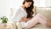 A women experiences symptoms associated with PMOS