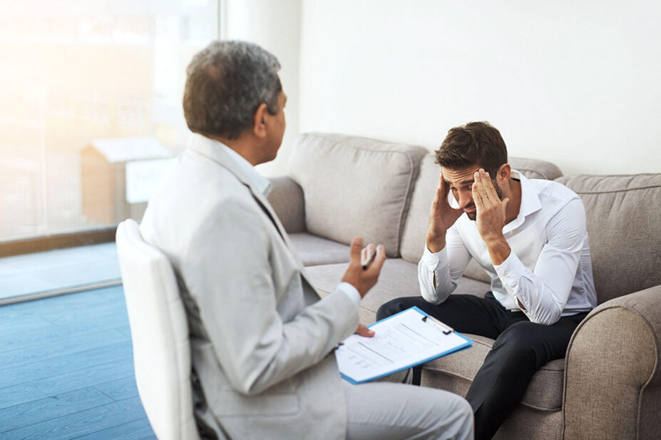 A mental health professional offers a counselling session with a patient