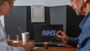 Pharmacist in consultation with older patient