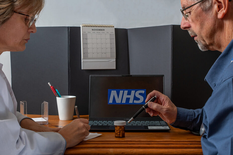 Pharmacist in consultation with older patient