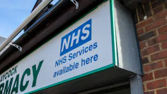 NHS services signage on community pharmacy frontage