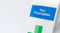 An image of a prescription in a paper bag