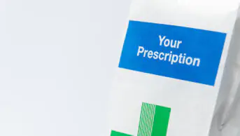 An image of a prescription in a paper bag
