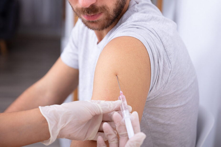 A man receives a vaccination