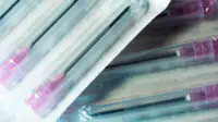 Hypodermic needles in plastic packaging