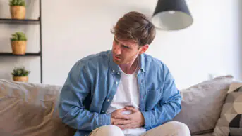 A man suffers from abdominal cramps