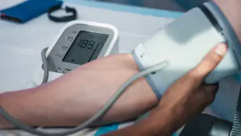 Patient having blood pressure measurement taken