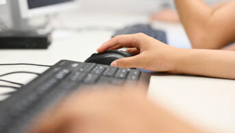 A healthcare professional uses a computer