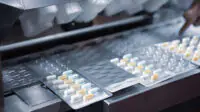 An image of blister packs of medicines being manufactured