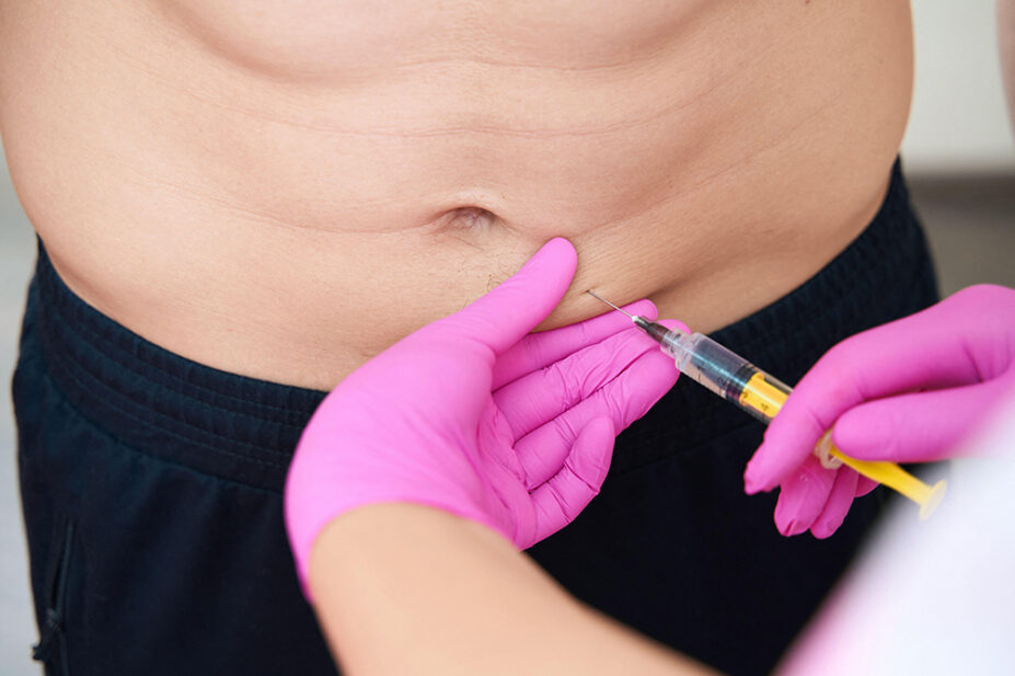 A man receives an injection in his abdomen