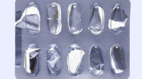 Close up of a empty pill blister on an off-white background