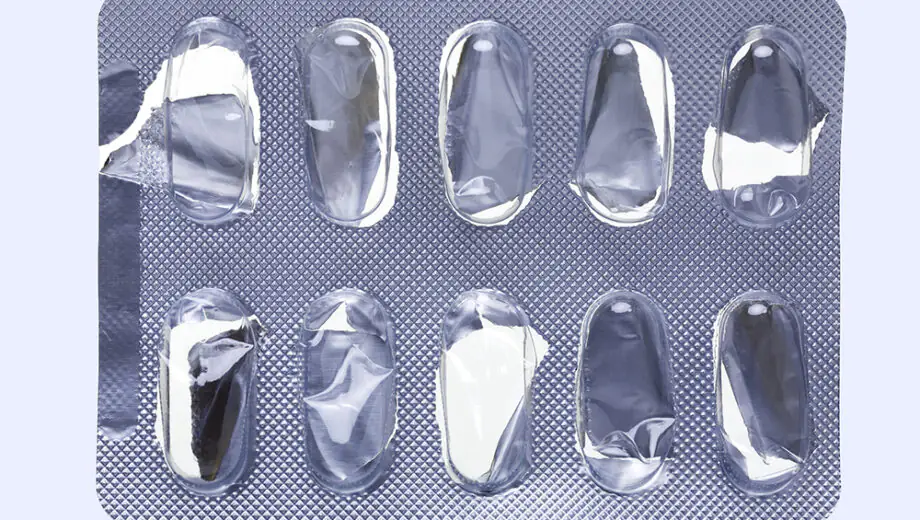 Close up of a empty pill blister on an off-white background