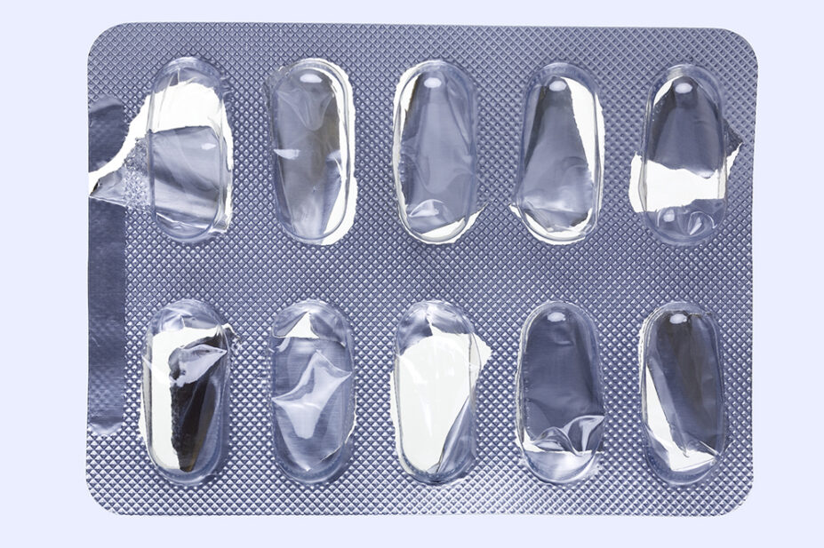 Close up of a empty pill blister on an off-white background
