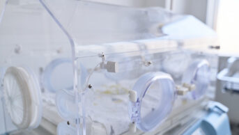 Newborn incubator in a modern neonatal unit during a bright day in a hospital