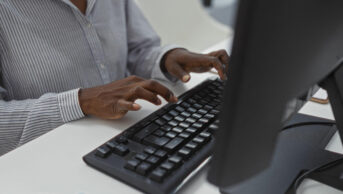A woman works on a computer
