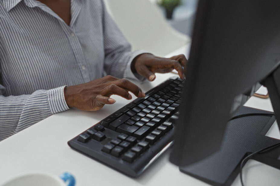 A woman works on a computer