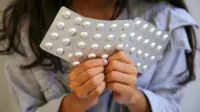 Methylphenidate ( Ritalin ) of Psychostimulants on Girl's hand