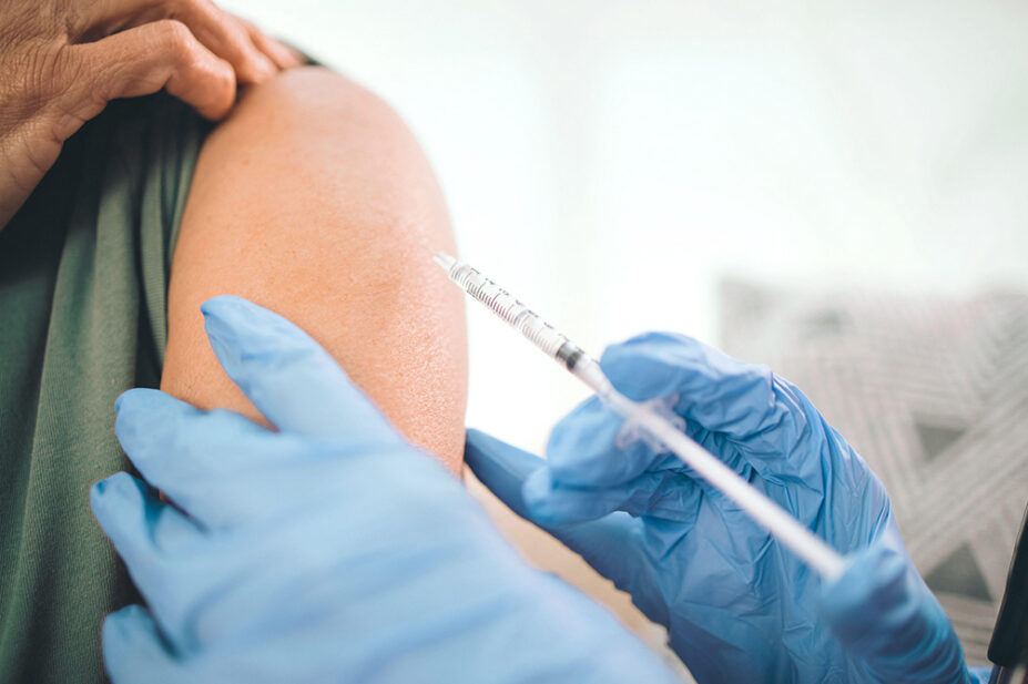 A person receives a vaccination in their upper arm
