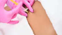 A person receives a lifting injection on her abdomen