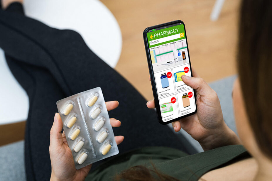 A man uses a distance-selling pharmacy on his phone to purchase medication