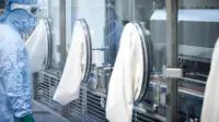 A scientistic works in an aseptic facility