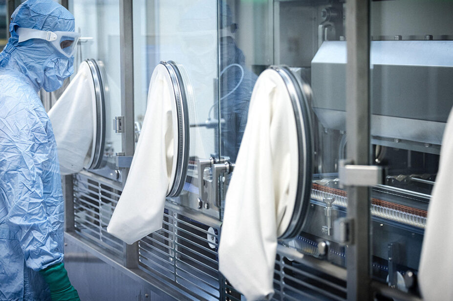 A scientistic works in an aseptic facility