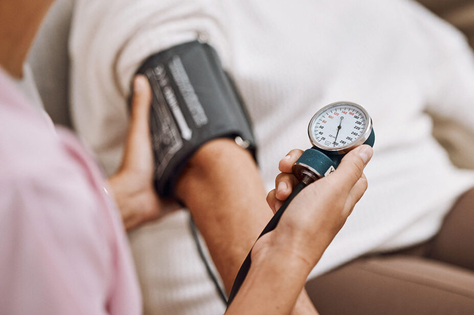 A healthcare professional checks a patient's blood pressure